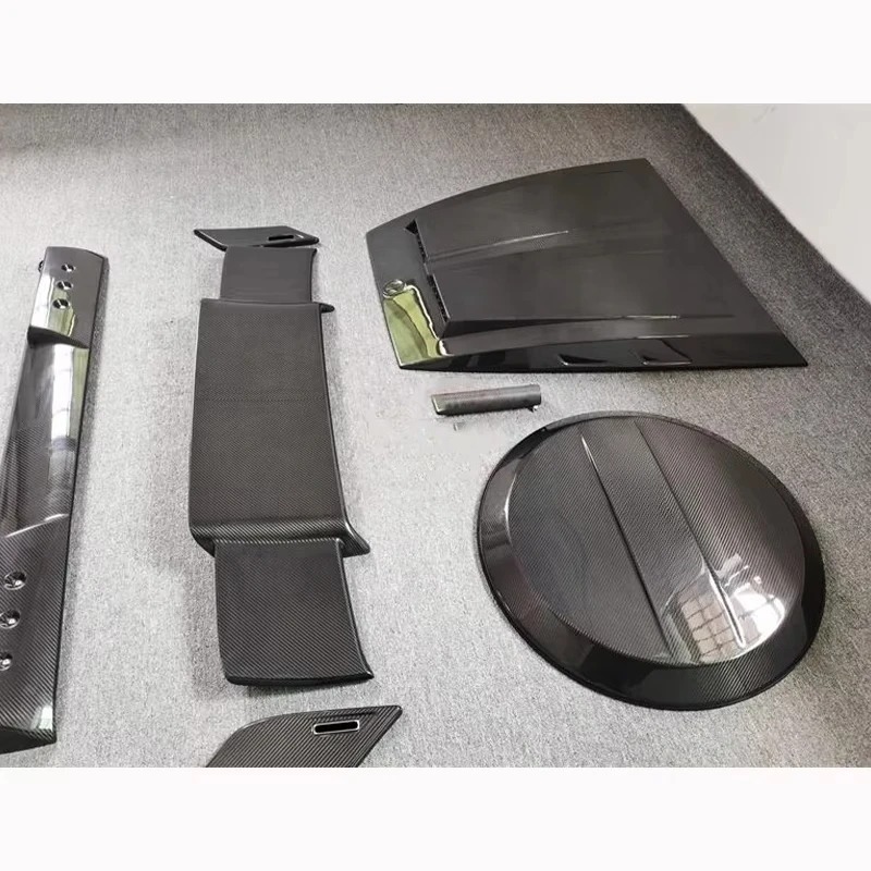 Suitable for 2019+ G-Class W463 W464 B-type Carbon Fiber 4-piece Set Engine Hood Roof Light Tire Cover Spoiler